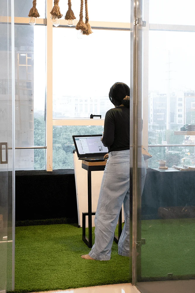 Standing Designer working on a laptop 